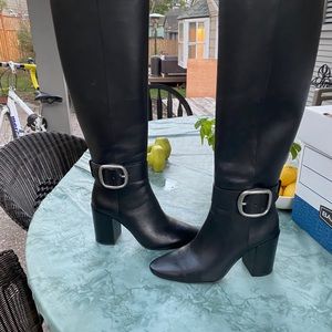 Black heeled Coach boots as seen on youtuber